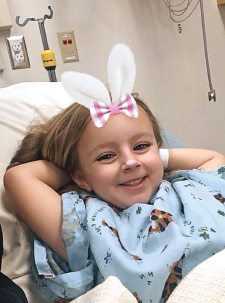 Addison wearing bunny ears during her treatment at St Jude's