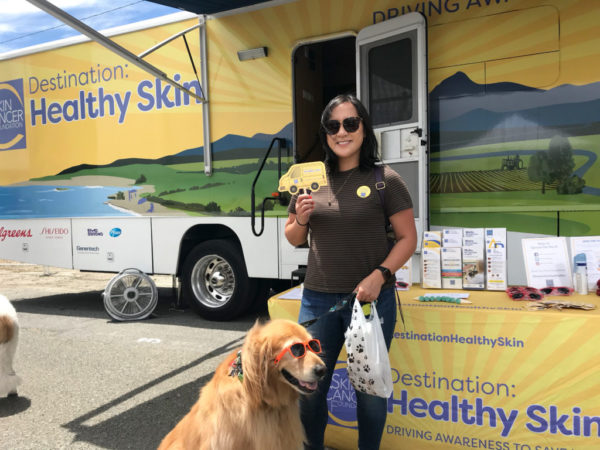 Dog and owner visiting Destination Healthy Skin RV