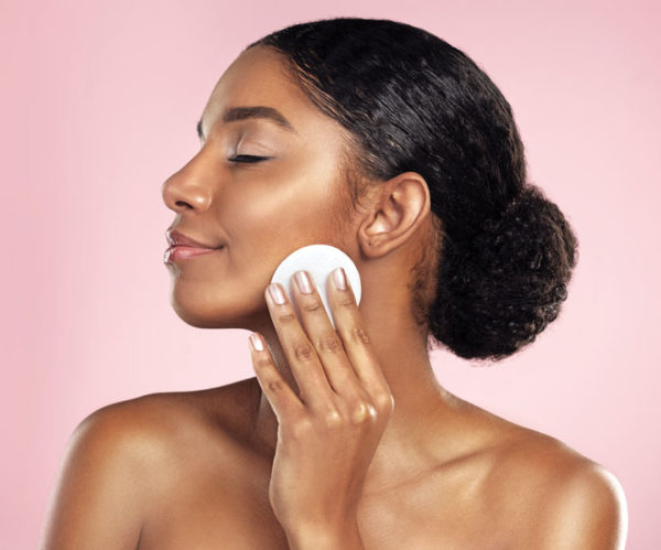 woman applying powder cosmetics