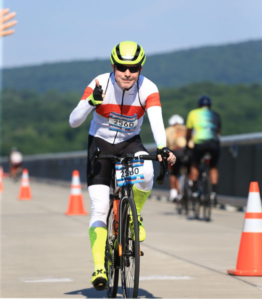 Picture of a man ridding a bike. The Skin Cancer Foundation