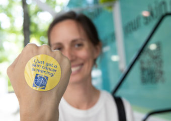 screening sticker on participant hand at Destination Healthy Skin