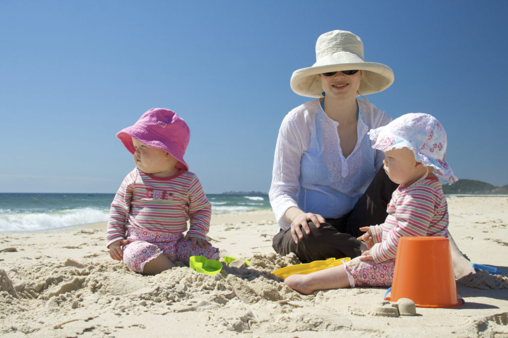 Woman with infants beach