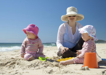 Woman with infants beach