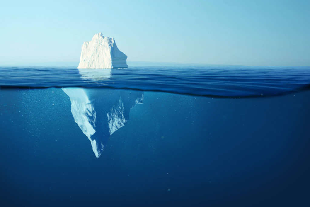 an iceberg with larger portion underwater