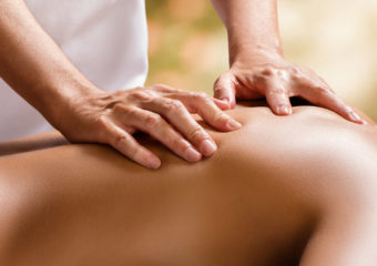 photo of hands on back massage