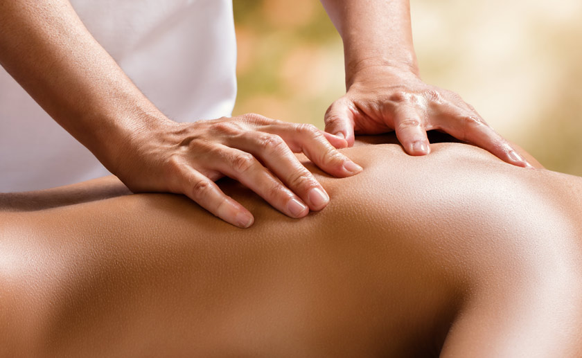 photo of hands on back massage