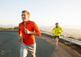 two young happy men running